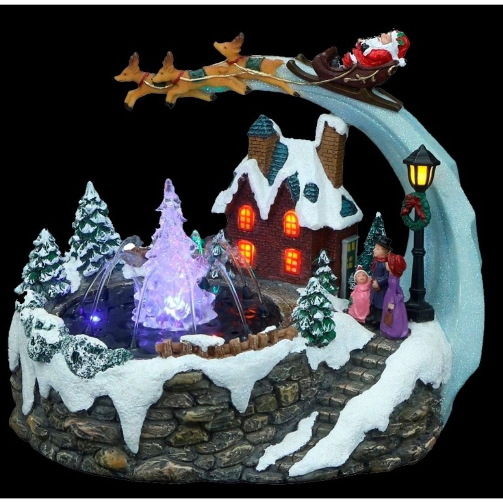 Cena luminosa com Papai Noel e fonte de água